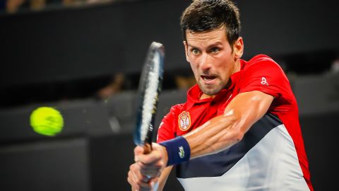 Novak Djokovic hits a return against Gael Monfils during the ATP Cup in Brisbane.