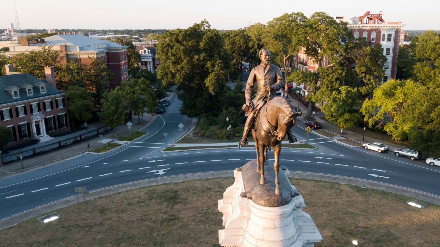 The early morning sun highlights the statue of Confederate General Robert E. Lee on Monument Avenue in Richmond, Virginia, on July 31, 2017.