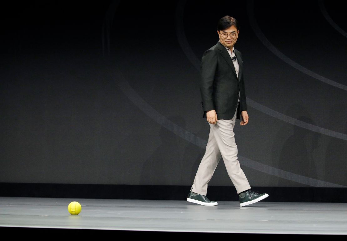 Hyun-Suk Kim, president and CEO of the Consumer Electronics Division at Samsung, demonstrates Ballie, an AI rolling robot during a Samsung keynote before the CES tech show, Monday, Jan. 6, 2020, in Las Vegas. 