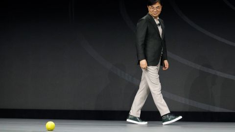 Hyun-Suk Kim, president and CEO of the Consumer Electronics Division at Samsung, demonstrates Ballie, an AI rolling robot during a Samsung keynote before the CES tech show, Monday, Jan. 6, 2020, in Las Vegas.