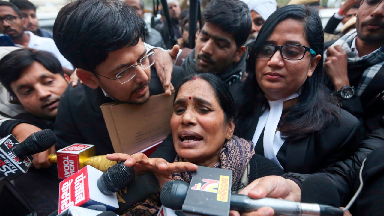 Asha Devi, mother of the victim of the fatal 2012 gang rape on a bus, leaves court in New Delhi on Tuesday, January 7.