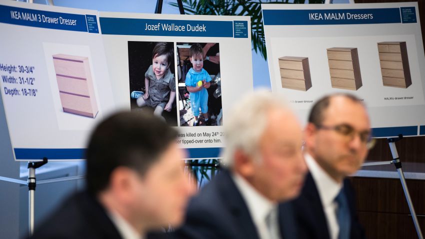 Placards showing images of Jozef Dudek and IKEA's Malm dressers are displayed during a news conference in Philadelphia, Monday, Jan. 6, 2020. IKEA has agreed to pay $46 million to the parents of a 2-year-old boy who died of injuries suffered when a 70-pound recalled dresser tipped over onto him, the family's lawyers said Monday. (AP Photo/Matt Rourke)