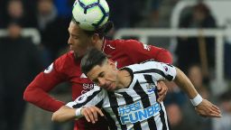 Liverpool's Dutch defender Virgil van Dijk (L) vies with Newcastle United's Spanish striker Ayoze Perez (R) to header the ball during the English Premier League football match between Newcastle United and Liverpool at St James' Park in Newcastle-upon-Tyne, north east England on May 4, 2019. (Photo by Lindsey PARNABY / AFP) / RESTRICTED TO EDITORIAL USE. No use with unauthorized audio, video, data, fixture lists, club/league logos or 'live' services. Online in-match use limited to 120 images. An additional 40 images may be used in extra time. No video emulation. Social media in-match use limited to 120 images. An additional 40 images may be used in extra time. No use in betting publications, games or single club/league/player publications. /         (Photo credit should read LINDSEY PARNABY/AFP via Getty Images)