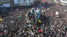 Iranian mourners gather around a vehicle carrying the coffin of slain top general Qasem Soleimani during the final stage of funeral processions, in his hometown Kerman on January 7, 2020. - Soleimani was killed outside Baghdad airport Friday in a drone strike ordered by US President Donald Trump, ratcheting up tensions with arch-enemy Iran which has vowed "severe revenge". The assassination of the 62-year-old heightened international concern about a new war in the volatile, oil-rich Middle East and rattled financial markets. (Photo by ATTA KENARE / AFP) (Photo by ATTA KENARE/AFP via Getty Images)