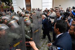 Venezuelan opposition lawmakers force their way into the National Assembly in Caracas, on January 7, 2020. 