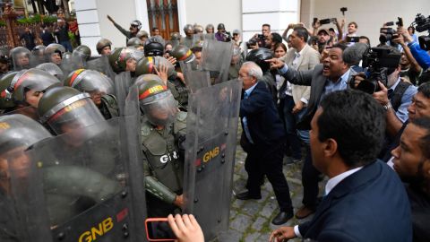Venezuelan opposition lawmakers force their way into the National Assembly in Caracas, on January 7, 2020. 