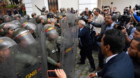 Venezuelan opposition lawmakers force their way into the National Assembly in Caracas, on January 7, 2020.