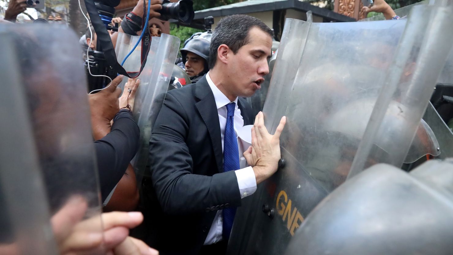 Opposition leader Juan Guaido attempts to surpass the national police block to the National Assembly entrance on January 7, 2020 in Caracas, Venezuela. 