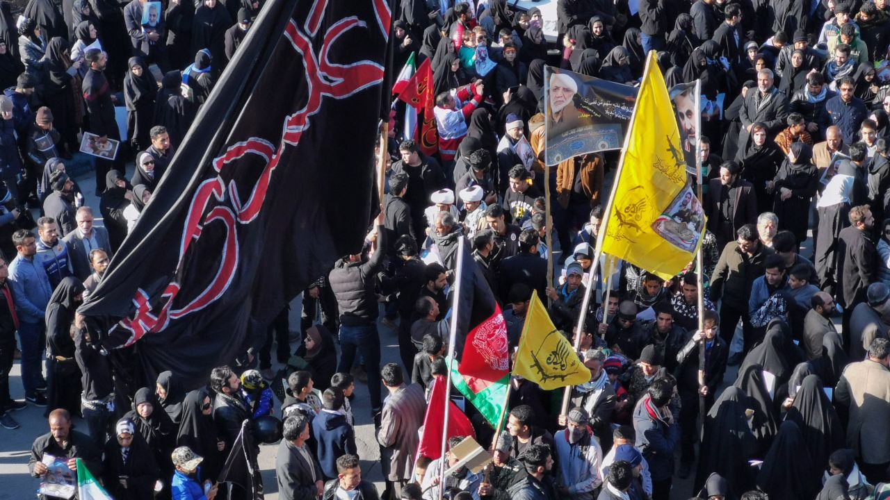 Iranian mourners gather for the burial of slain top general Qasem Soleimani in his hometown Kerman on January 7, 2020. - Soleimani was killed outside Baghdad airport Friday in a drone strike ordered by US President Donald Trump, ratcheting up tensions with arch-enemy Iran which has vowed "severe revenge". The assassination of the 62-year-old heightened international concern about a new war in the volatile, oil-rich Middle East and rattled financial markets. (Photo by Atta KENARE / AFP) (Photo by ATTA KENARE/AFP via Getty Images)