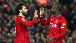 LIVERPOOL, ENGLAND - JANUARY 02: Mohamed Salah of Liverpool celebrates with Sadio Mane after scoring his team's first goal during the Premier League match between Liverpool FC and Sheffield United at Anfield on January 02, 2020 in Liverpool, United Kingdom. (Photo by Clive Brunskill/Getty Images)