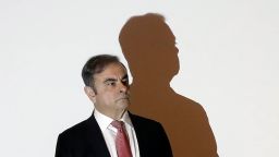 Former Renault-Nissan boss Carlos Ghosn is pictured at the podium at the Lebanese Press Syndicate where he addressed a large crowd of journalists on his reasons for dodging trial in Japan, where he is accused of financial misconduct, in Beirut on January 8, 2020. - The 65-year-old fugitive auto tycoon vowed to clear his name as he made his first public appearance at a news conference in Beirut since skipping bail in Japan. Ghosn, who denies any wrongdoing, fled charges of financial misconduct including allegedly under-reporting his compensation to the tune of $85 million. (Photo by JOSEPH EID/AFP via Getty Images)
