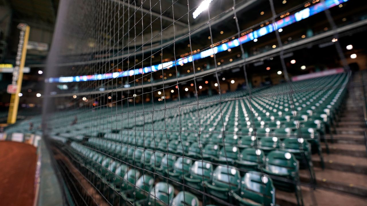Newly installed netting extends down the right field line inside Minute Maid Park, home of the Houston Astros baseball team, Monday, Aug. 19, 2019, in Houston. Knotless netting was recently extended down both foul lines to better protect fans. (AP Photo/David J. Phillip)