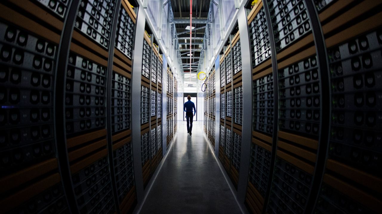 A worker walks in one of the server rooms at a Facebook Data Center in Swedish Lapland in 2013.