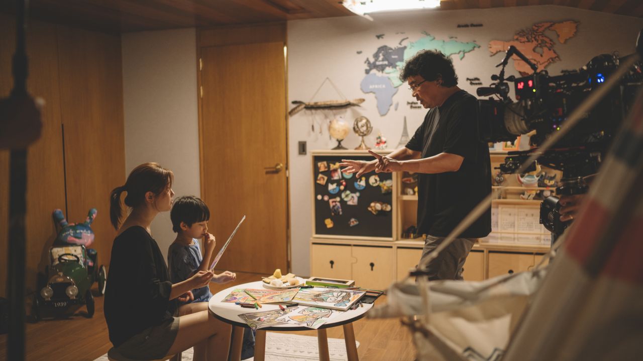 Park So Dam (left) and Jung Hyeon Jun (second left) receive direction Bong Joon Ho on the set of "Parasite."