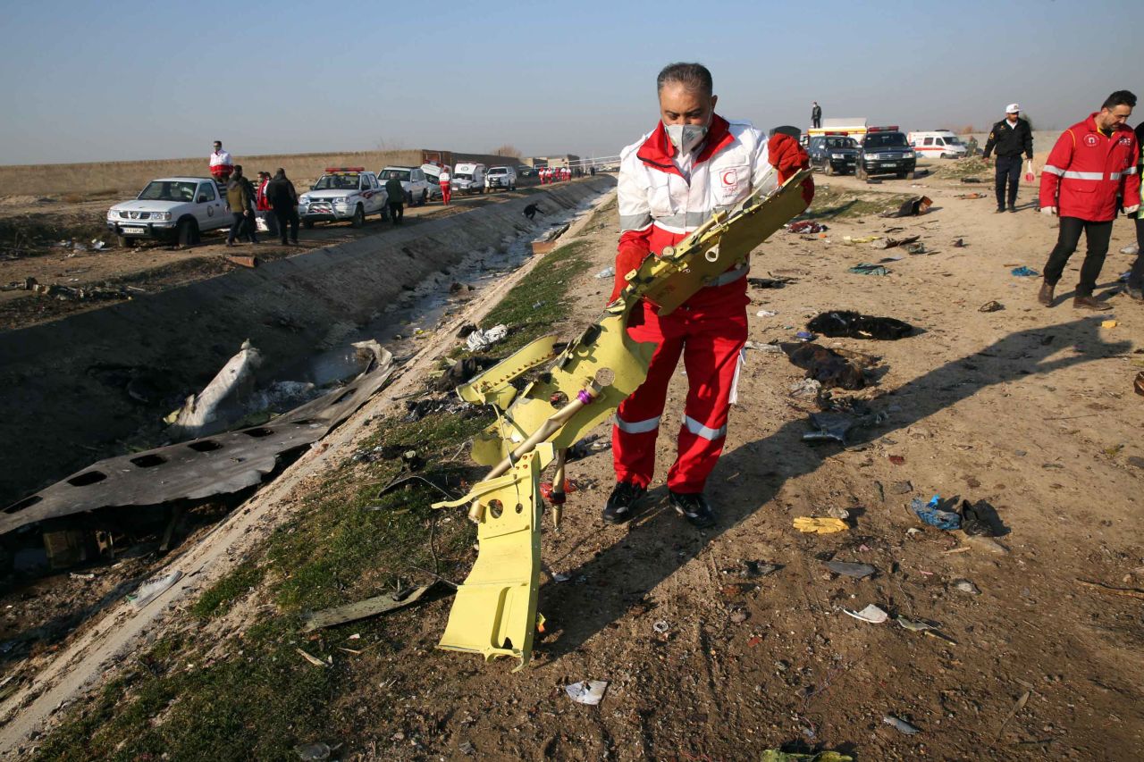 Authorities recover debris from the plane.