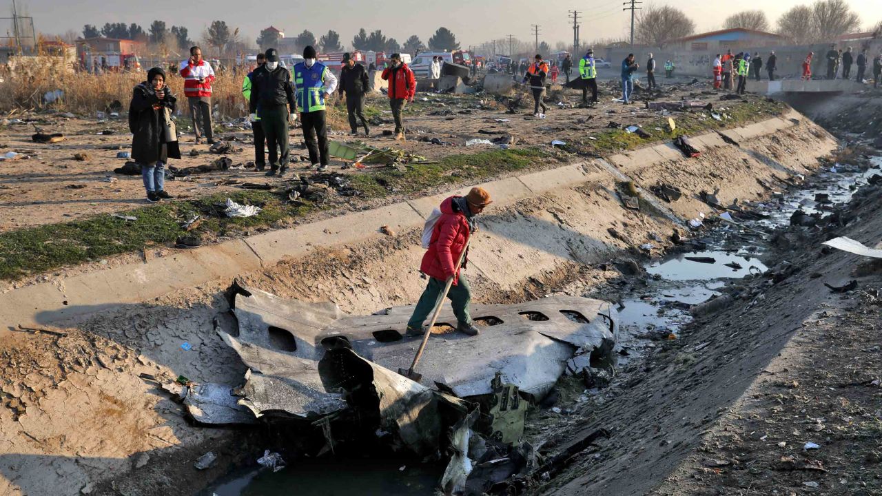 Rescue workers inspect the scene where a Ukrainian airliner crashed in Shahedshahr, southwest of the Iranian capital, Tehran.
