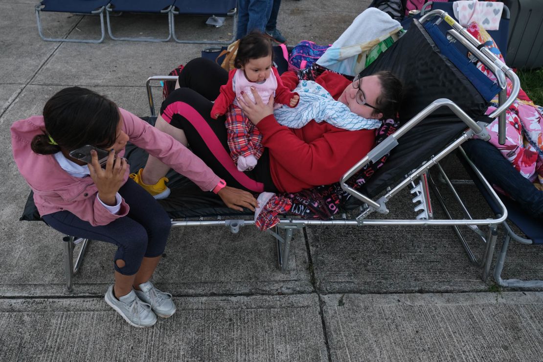Tatiana Rodriguez, right, and family members are taking shelter at a school in Guayanilla. 
