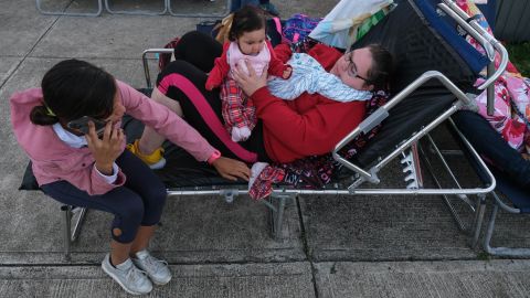 Tatiana Rodriguez, right, and family members are taking shelter at a school in Guayanilla. 