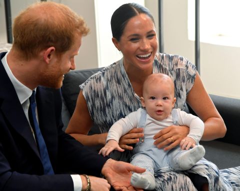 Meghan holds Archie during the South African tour.