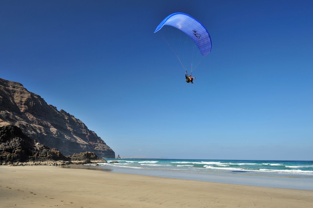 These paragliders are taking in the views in Playa de la Canteria.