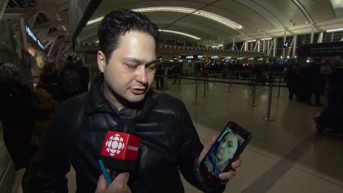 Hassan Shadkhoo shows a photo of his wife of 10 years, Sheyda Shadkhoo.