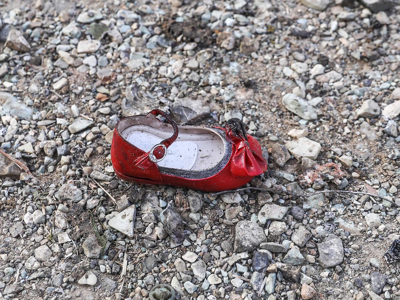 A child's shoe is pictured at the scene of the crash.
