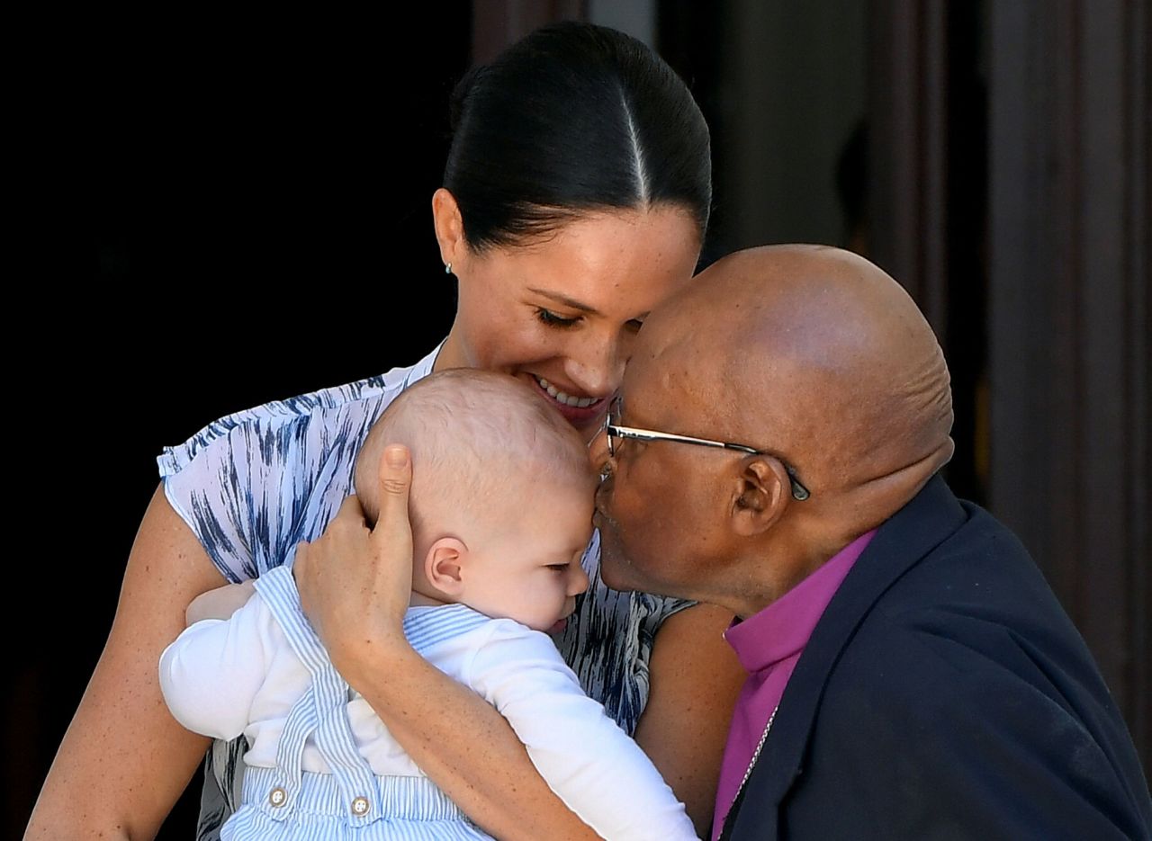 Archbishop Desmond Tutu kisses Archie, Meghan and Harry's son, in September 2019.