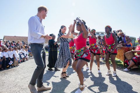 Harry and Meghan dance during their royal tour of South Africa in September 2019.