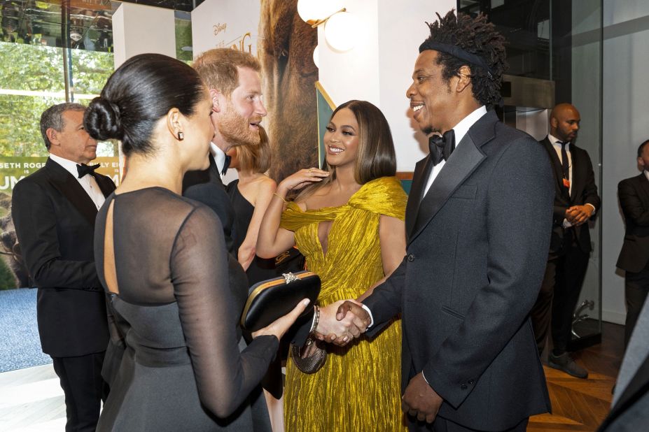 Harry and Meghan greet singer Beyoncé and her husband, rapper Jay-Z, as they attend the European premiere of the film "The Lion King" in July 2019.