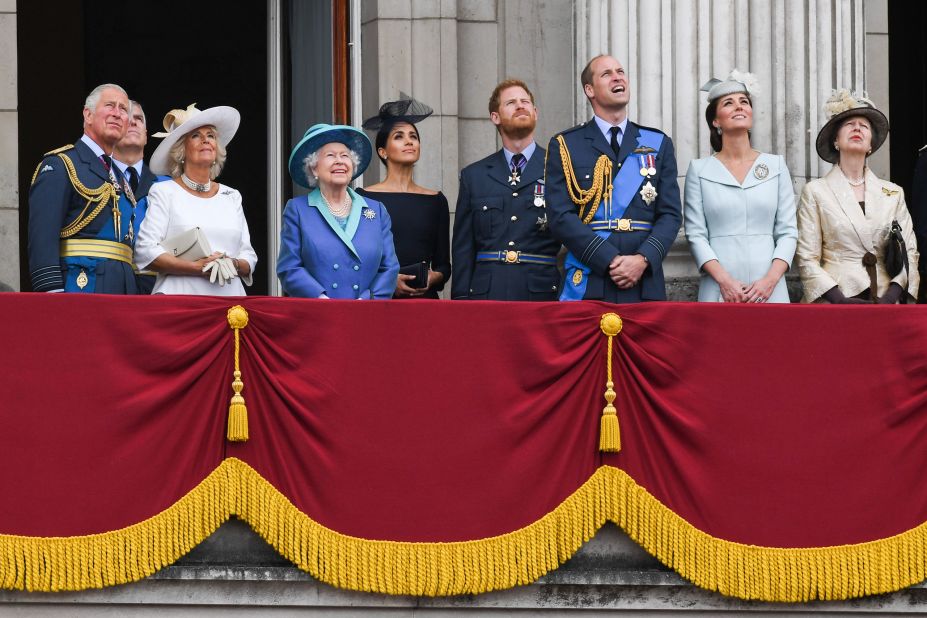 Members of the royal family watch a flyover during a July 2018 event marking the centenary of the Royal Air Force. From left are Prince Charles; Prince Andrew; Camilla, Duchess of Cornwall; Queen Elizabeth II; Meghan; Harry; Prince William; and Catherine, Duchess of Cambridge.