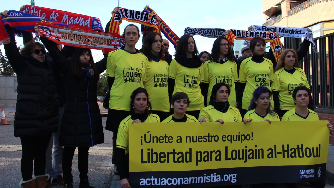 Women from Amnesty International protest outside the Saudi embassy in Madrid.