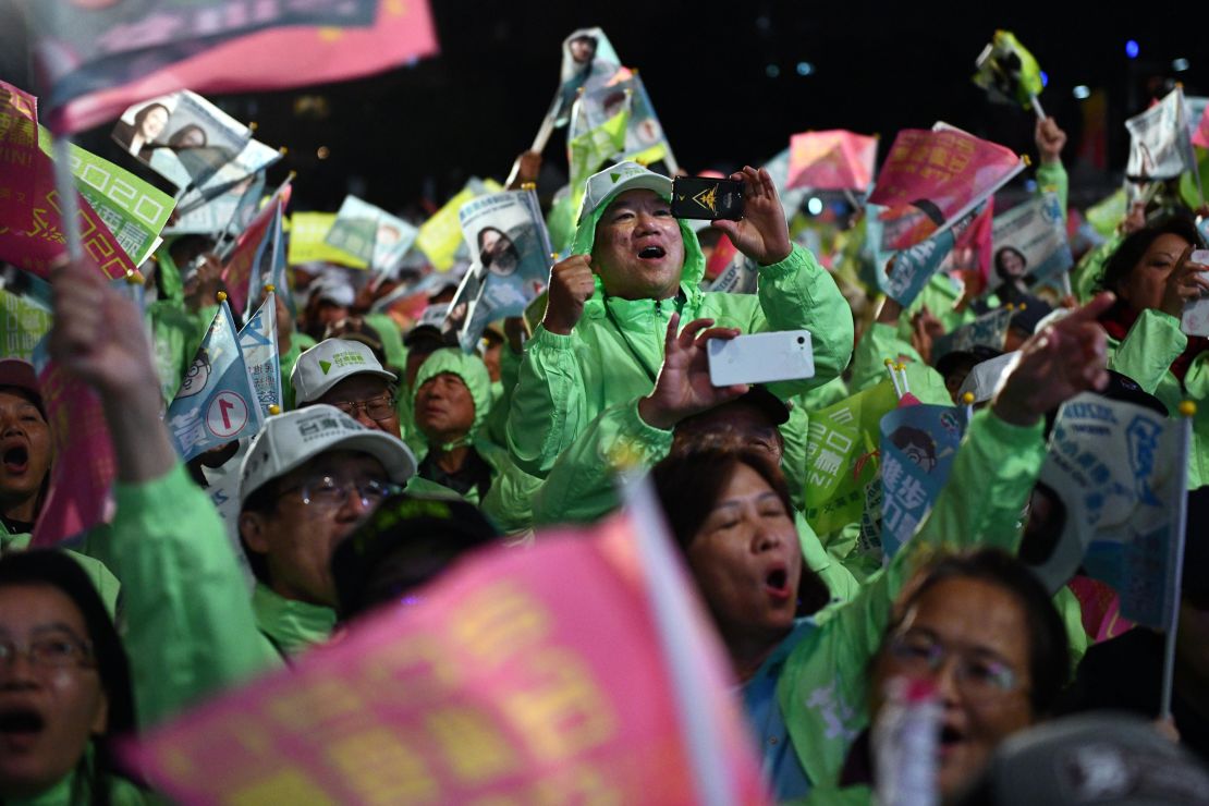 Supporters of Taiwan's current president and Democratic Progressive Party presidential candidate, Tsai Ing-wen, cheer at a rally in Taoyuan on January 8, 2020.