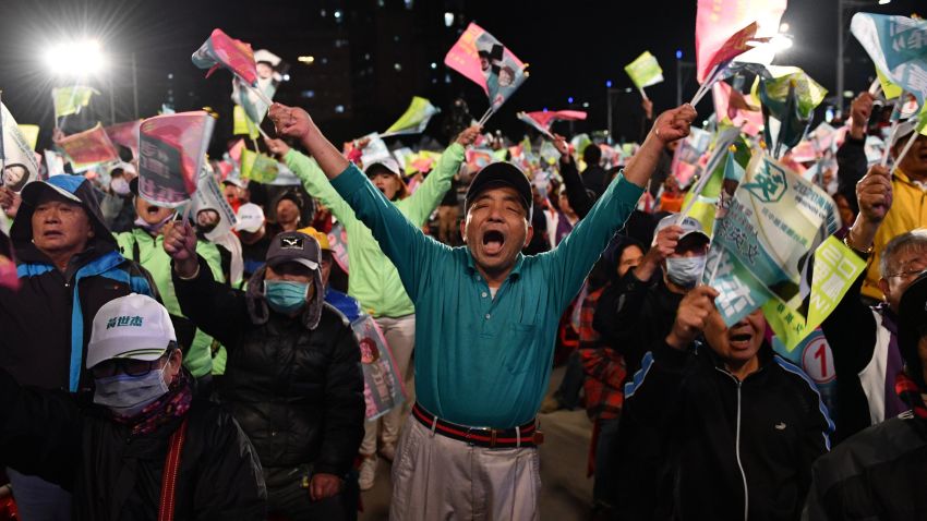 TAOYUAN, TAIWAN - JANUARY 08: A supporter cheers and waves flags as Taiwan's current president and Democratic Progressive Party presidential candidate, Tsai Ing-wen, speaks during a rally ahead of Saturday's presidential election on January 8, 2020 in Taoyuan, Taiwan. Taiwan will go to the polls on Saturday after a campaign in which fake news and the looming shadow of China and its repeated threats of invasion have played a prominent role in shaping debate. Ensuring Taiwan's democratic way of life has dominated an election which will be closely fought between incumbent, anti-China president Tsai Ing-wen and the more pro-Beijing challenger Han Kuo-yu. (Photo by Carl Court/Getty Images)