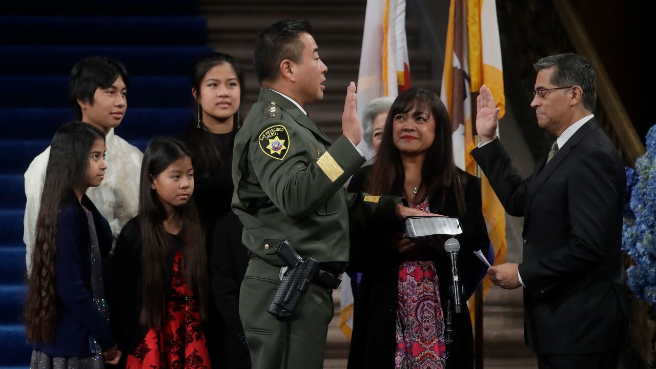 His family watches as Miyamoto is sworn in by California Attorney General Xavier Becerra.