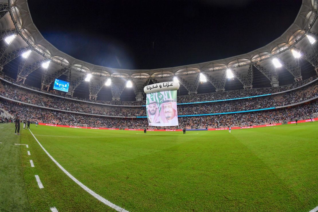 Portraits of Saudi Crown Prince Mohammed bin Salman (L) and Saudi King Salman bin Abdulaziz are displayed during the Spanish Super Cup semi final between Valencia and Real Madrid.