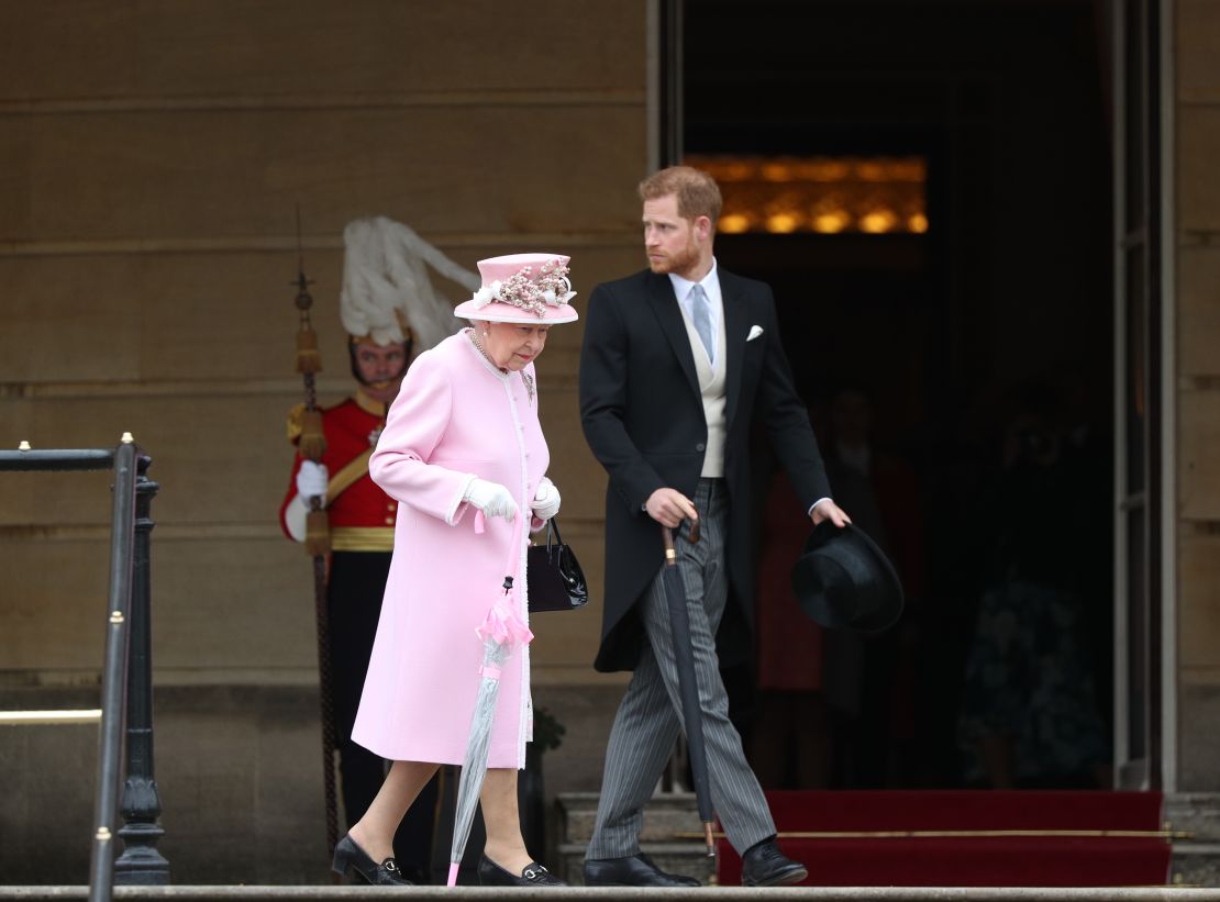 The Queen and Harry arrive at the Queen's Garden Party in Buckingham Palace on May 29, 2019.