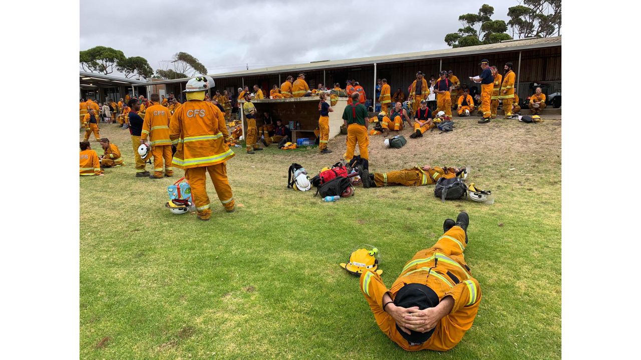 Firefighters relax between shifts battling the bushfires.