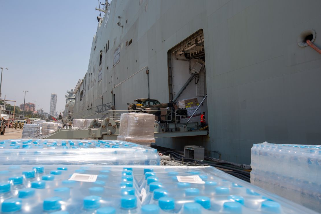 Supplies being loaded onto HMAS Adelaide to assist with the bushfire crisis.