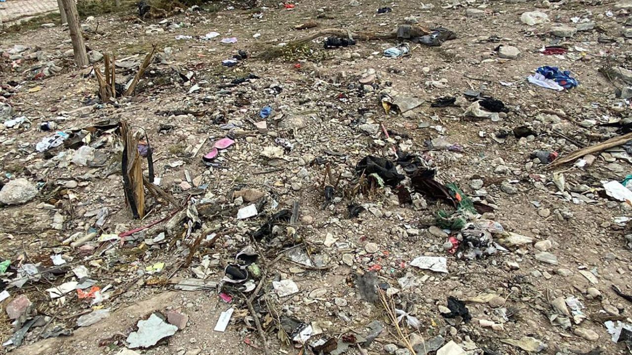 Debris, including passengers' personal items, at the scene.