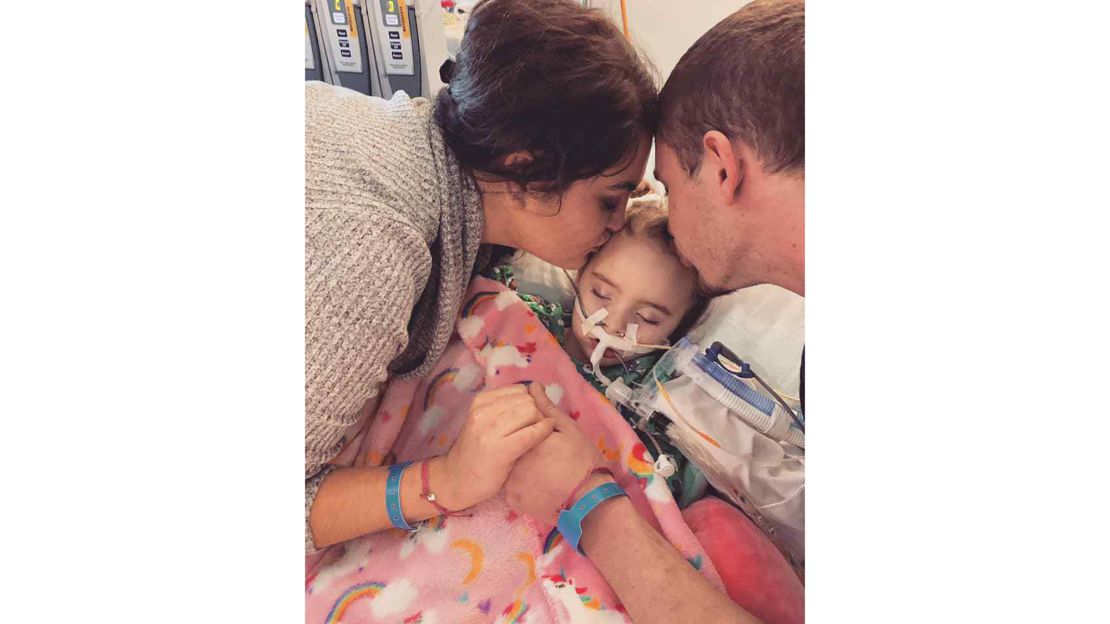 Amanda Phillips and Stephen DeLucia with their daughter, Jade DeLucia, at the University of Iowa Stead Family Children's Hospital.