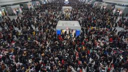 Crowds of travelers walk through a hall at a railway station in Hangzhou in China's eastern Zhejiang province on the last day of the Spring Festival holiday on February 10, 2019. - Millions of people across China are returning from their hometowns after the week-long Spring Festival break, which marks the beginning of the Lunar New Year. (Photo by STR / AFP) / China OUT        (Photo credit should read STR/AFP via Getty Images)