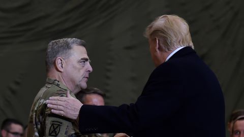 US President Donald Trump shakes hands with Joint Chiefs Chairman General Mark Milley after addressing the troops at Bagram Air Field during a surprise Thanksgiving day visit, on November 28, 2019 in Afghanistan.