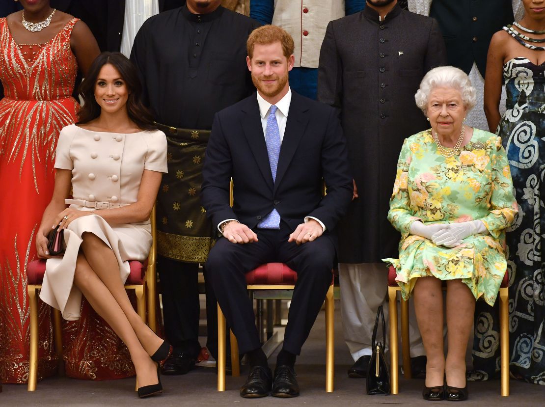 Meghan, Duchess of Sussex, Prince Harry, Duke of Sussex and Queen Elizabeth II at the Queen's Young Leaders Awards Ceremony at Buckingham Palace in June, 2018.