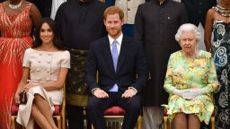 LONDON, ENGLAND - JUNE 26: Meghan, Duchess of Sussex, Prince Harry, Duke of Sussex and Queen Elizabeth II at the Queen's Young Leaders Awards Ceremony at Buckingham Palace on June 26, 2018 in London, England. The Queen's Young Leaders Programme, now in its fourth and final year, celebrates the achievements of young people from across the Commonwealth working to improve the lives of people across a diverse range of issues including supporting people living with mental health problems, access to education, promoting gender equality, food scarcity and climate change.  (Photo by John Stillwell - WPA Pool/Getty Images)