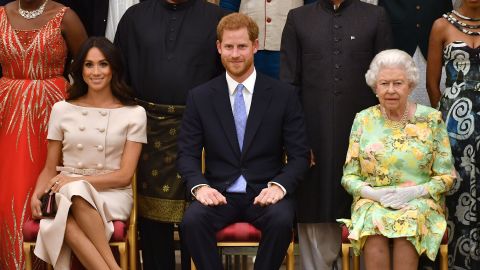 Meghan, Duchess of Sussex, Prince Harry, Duke of Sussex and Queen Elizabeth II at the Queen's Young Leaders Awards Ceremony at Buckingham Palace in June, 2018.