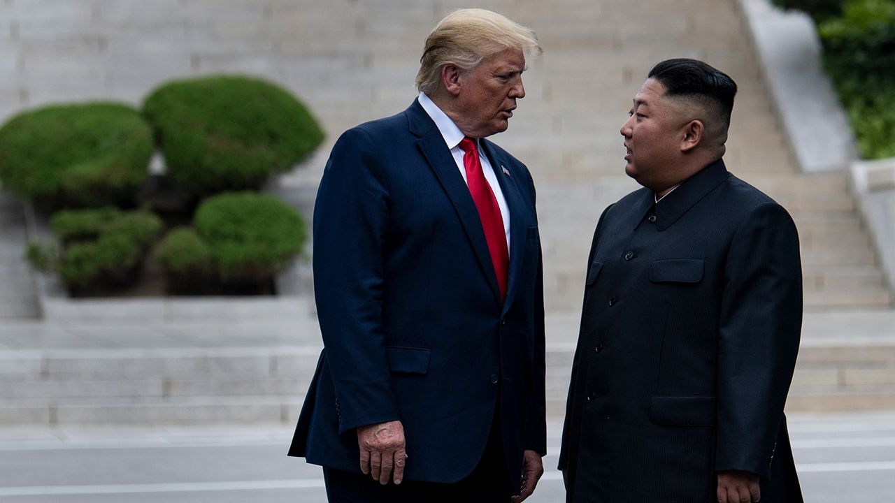 President Donald Trump and North Korean leader Kim Jong Un stand on North Korean soil while walking to South Korea in the Demilitarized Zone on June 30, 2019, in Panmunjom, Korea. (Photo by Brendan Smialowski / AFP)