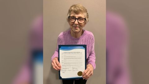 Linda Herring holds the resolution from the Johnson County Board of Supervisors honoring her for fostering more than 600 children. 
