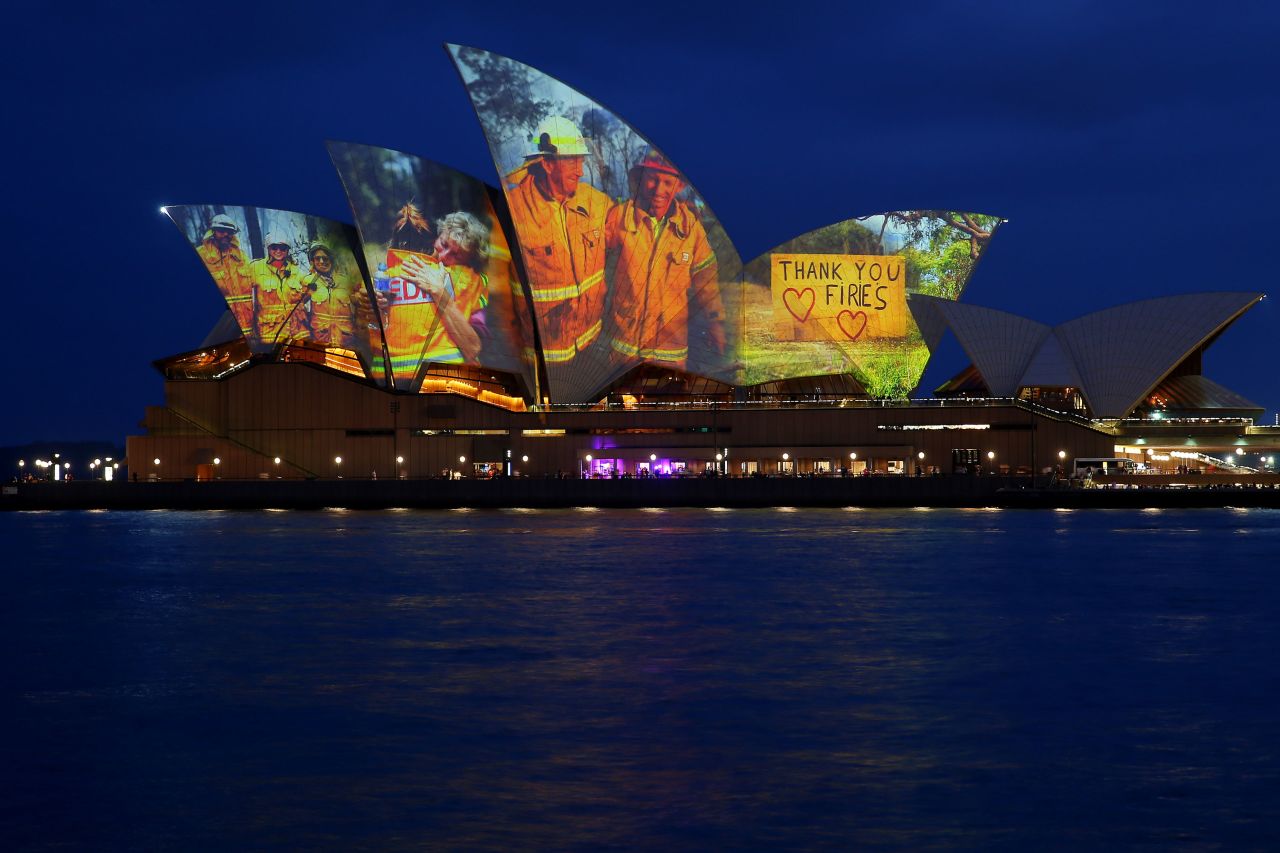 Pictures of firefighters are projected onto the Sydney Opera House on January 11.