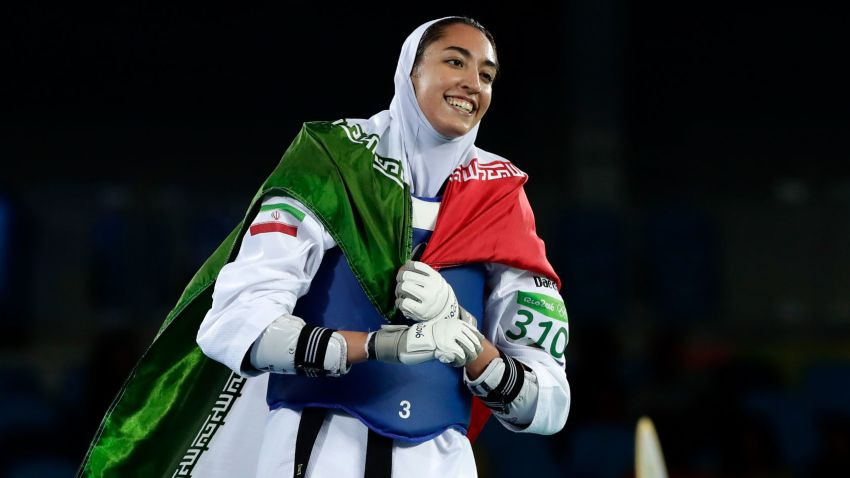 Kimia Alizadeh Zenoorin, of Iran, celebrates after winning a bronze medal in women's 57-kg taekwondo competition at the 2016 Summer Olympics in Rio de Janeiro, Brazil, Thursday, Aug. 18, 2016. (AP Photo/Robert F. Bukaty)