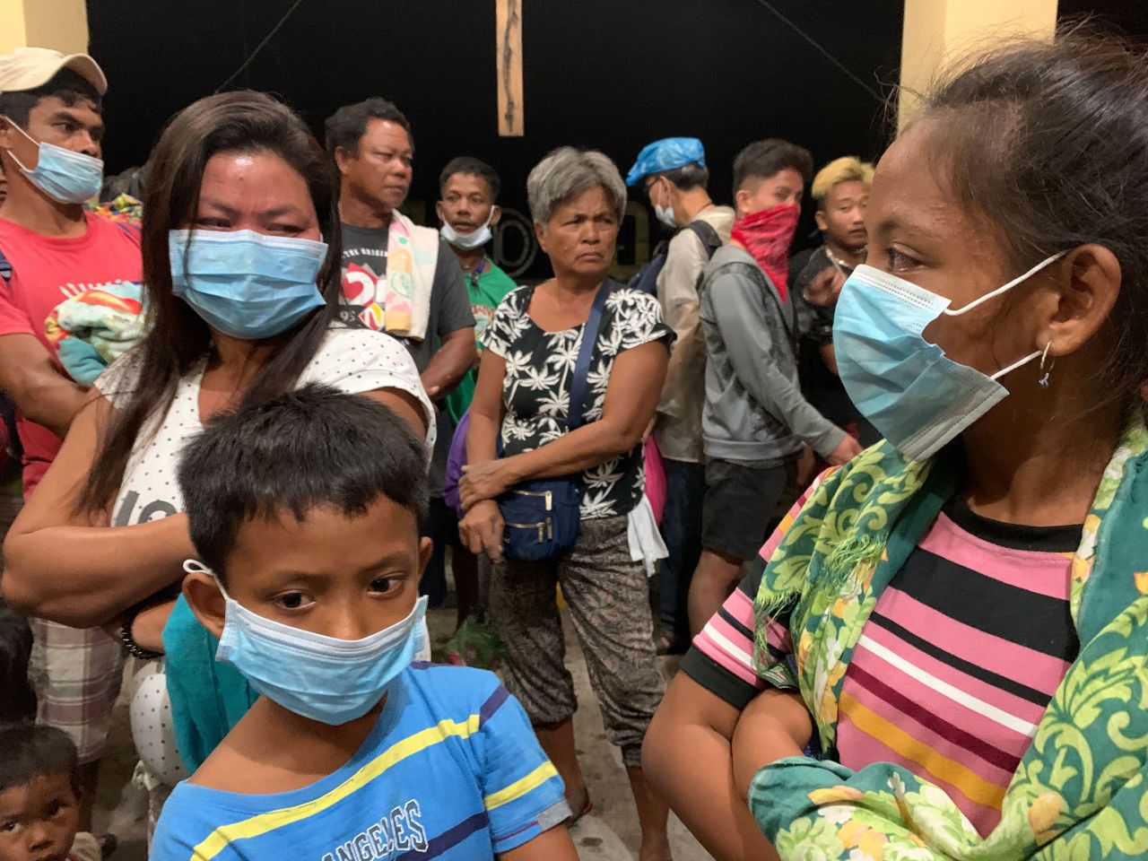 Villagers take shelter inside a church in Talisay.